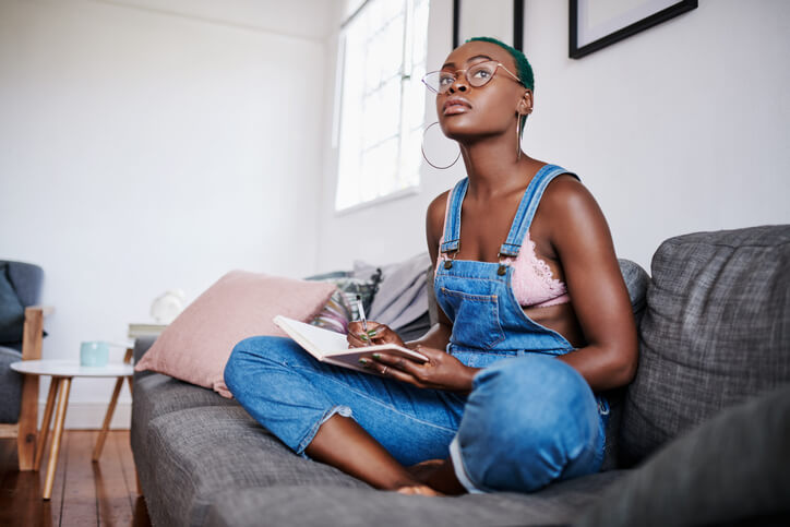 girl writing a journal for personal growth