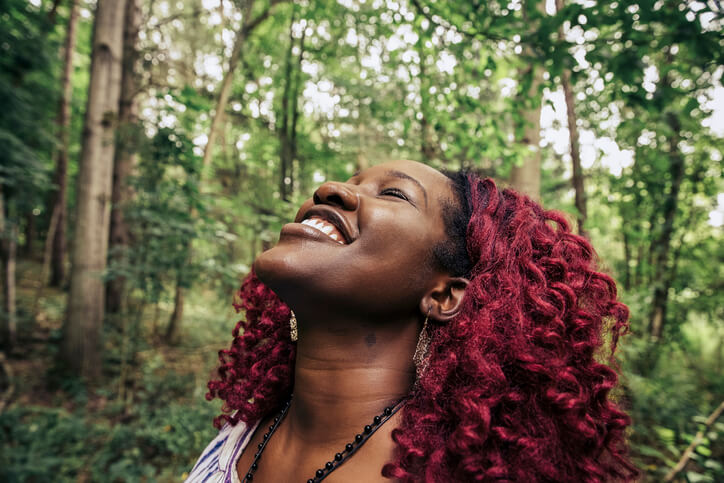 woman enjoying nature for better wellness and health