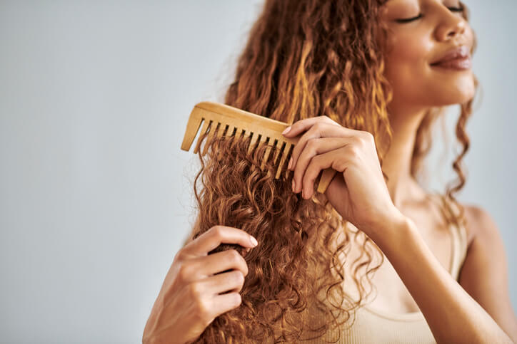 woman using comb for hair